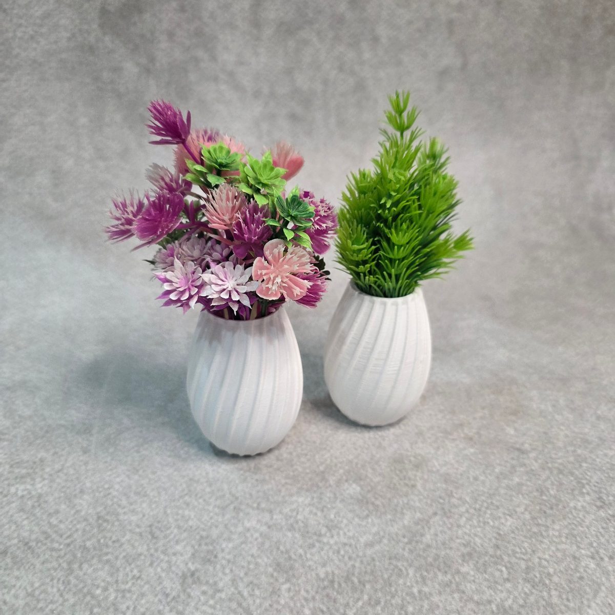 Small egg shaped grooved 3D printed vase
