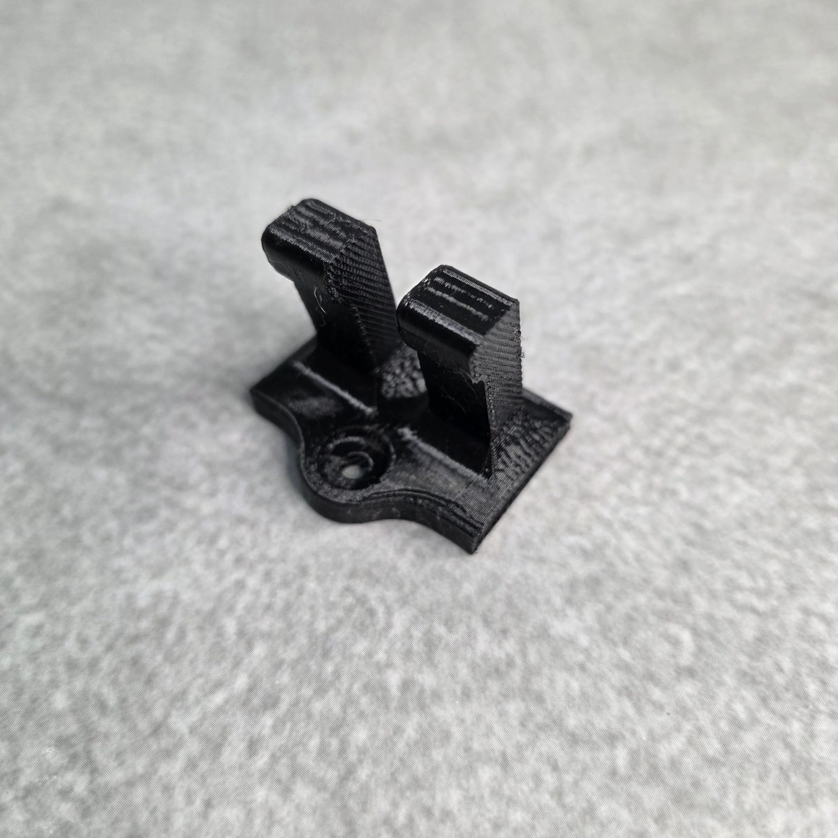 Twin arm wall hook