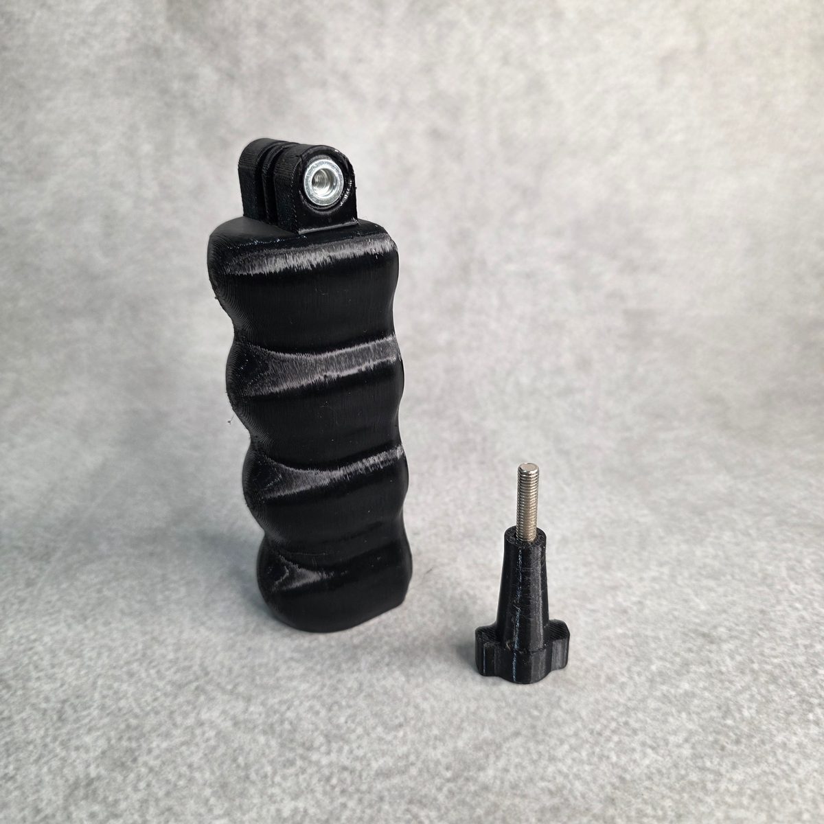 Action camera hand grip and vlogging handle, 40 x 40 x 130 mm single piece body